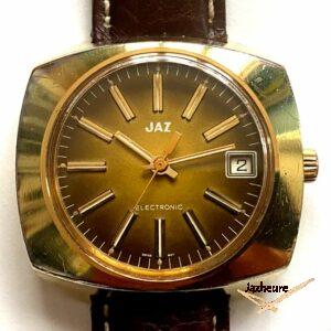 Montre Jaz Electronic EL 1004 (1975-1977), cadran brun degagé,, correcteur de date rapide, pile UC 343, calibre ESA 9157, prix 275Frs