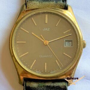 Montre Jaz Quartz HZ-2335 (1979), calibre ESA 944.111, cadran et index plaqués. Date rapide.